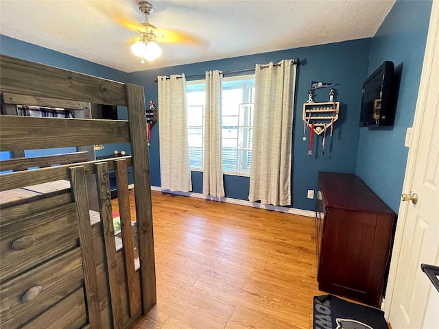 101 Branch St, Pittsburg, TX 75686 - bedroom featuring wood finished floors and a ceiling fan