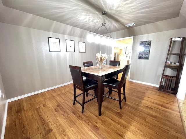 101 Branch St, Pittsburg, TX 75686 - dining room with wood finished floors and a textured wall
