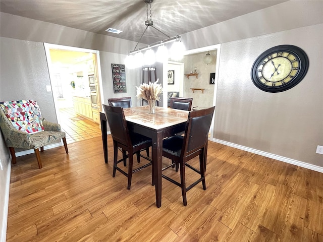 101 Branch St, Pittsburg, TX 75686 - dining room with light wood-type flooring and a textured wall