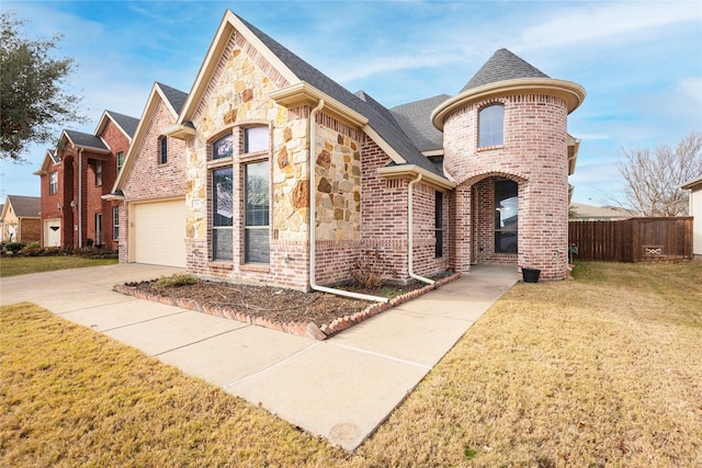 211 Wooded Creek Ave, Wylie, TX 75098 - french country home featuring a shingled roof, concrete driveway, brick siding, and stone siding