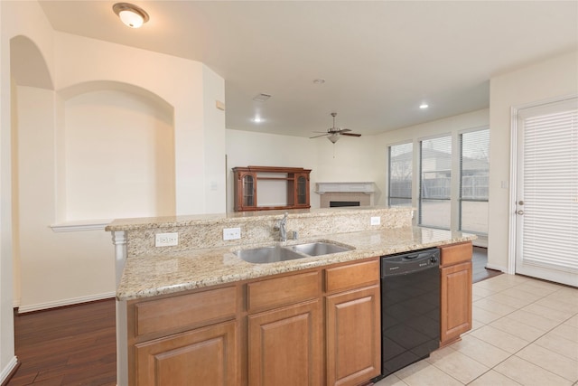 211 Wooded Creek Ave, Wylie, TX 75098 - kitchen featuring dishwasher, open floor plan, a ceiling fan, light stone counters, and an island with sink