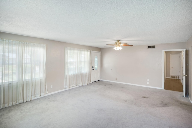 104 Charles Ln, Terrell, TX 75160 - carpeted spare room with a ceiling fan and a textured ceiling