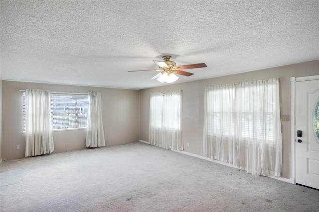 104 Charles Ln, Terrell, TX 75160 - unfurnished room featuring a ceiling fan, carpet, and a textured ceiling