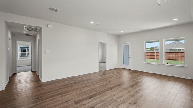 441 Drake Dr, Ferris, TX 75125 - spare room with dark wood-style floors and recessed lighting