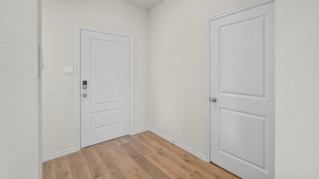 441 Drake Dr, Ferris, TX 75125 - entryway with light wood-style flooring and baseboards