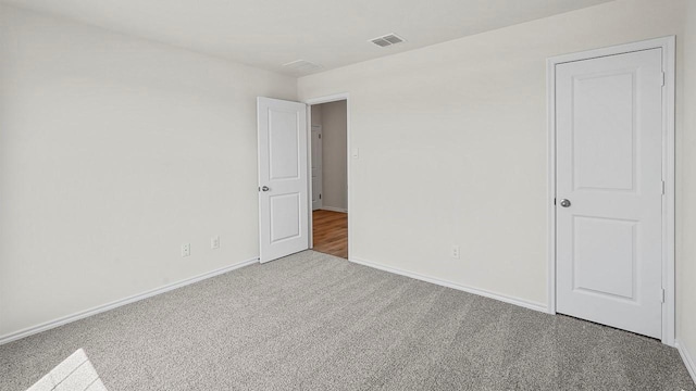 441 Drake Dr, Ferris, TX 75125 - unfurnished bedroom with carpet floors and baseboards
