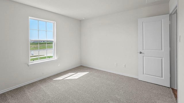 441 Drake Dr, Ferris, TX 75125 - carpeted empty room featuring baseboards