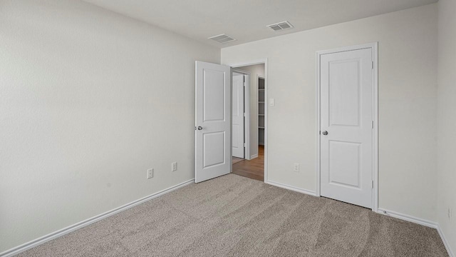 441 Drake Dr, Ferris, TX 75125 - unfurnished bedroom featuring carpet and baseboards