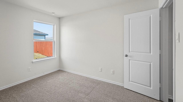 441 Drake Dr, Ferris, TX 75125 - empty room with carpet floors and baseboards