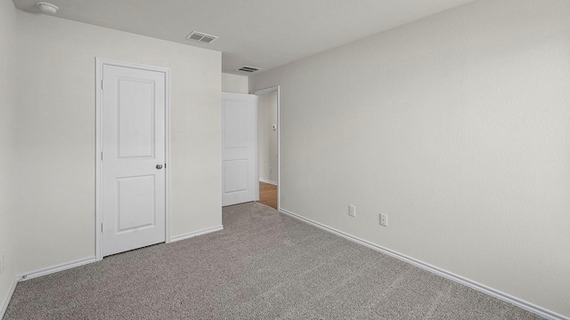 441 Drake Dr, Ferris, TX 75125 - unfurnished bedroom featuring carpet flooring and baseboards