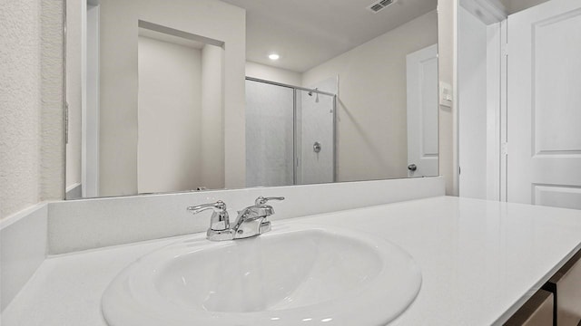 441 Drake Dr, Ferris, TX 75125 - bathroom featuring a shower stall, vanity, and recessed lighting
