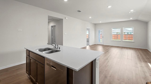 441 Drake Dr, Ferris, TX 75125 - kitchen featuring dishwasher, light wood-style flooring, light countertops, an island with sink, and recessed lighting