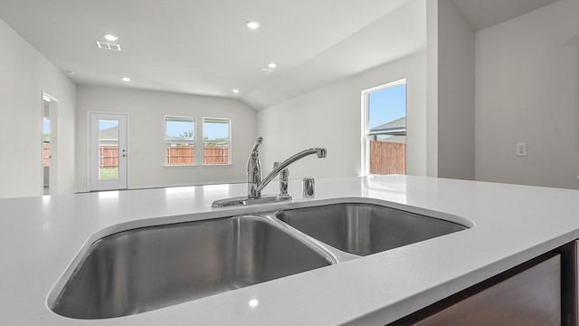 441 Drake Dr, Ferris, TX 75125 - kitchen featuring light countertops, recessed lighting, and lofted ceiling