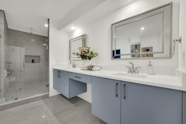 6910 Midcrest Dr, Dallas, TX 75254 - bathroom featuring double vanity, a shower stall, and recessed lighting