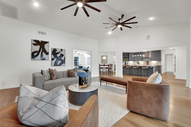 6910 Midcrest Dr, Dallas, TX 75254 - living area featuring a ceiling fan, light wood-type flooring, high vaulted ceiling, and recessed lighting