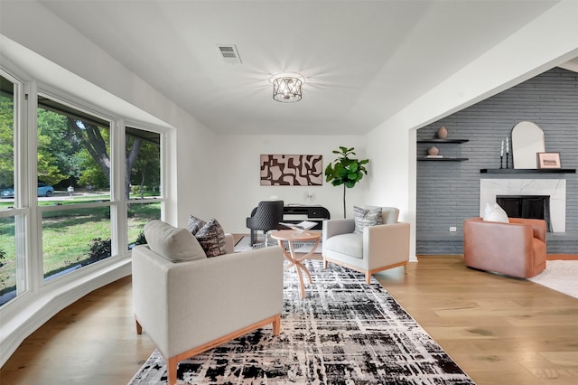6910 Midcrest Dr, Dallas, TX 75254 - living room featuring wood finished floors and a premium fireplace