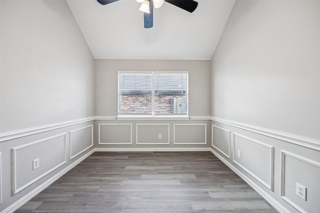 6945 Stockton Dr, Fort Worth, TX 76132 - spare room with a ceiling fan, lofted ceiling, a decorative wall, a wainscoted wall, and wood finished floors