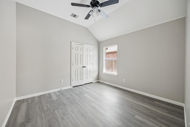 6945 Stockton Dr, Fort Worth, TX 76132 - unfurnished bedroom with wood finished floors, lofted ceiling, a closet, and ceiling fan