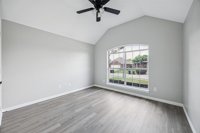 6945 Stockton Dr, Fort Worth, TX 76132 - spare room with wood finished floors, ceiling fan, and vaulted ceiling