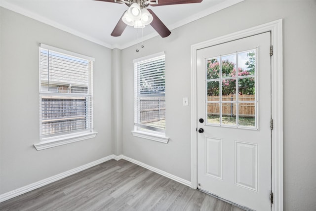 6945 Stockton Dr, Fort Worth, TX 76132 - doorway to outside with light wood-type flooring, ceiling fan, healthy amount of natural light, and ornamental molding