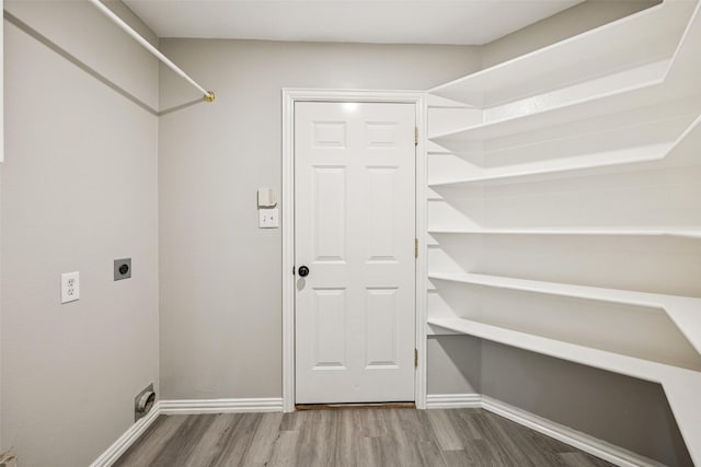 6945 Stockton Dr, Fort Worth, TX 76132 - laundry area featuring hookup for an electric dryer and wood finished floors