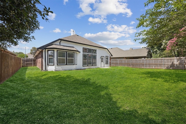 6945 Stockton Dr, Fort Worth, TX 76132 - back of house featuring a fenced backyard and a chimney