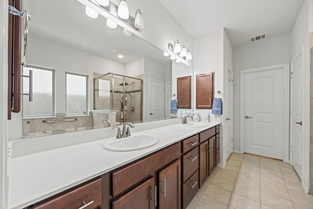 2025 Meliana Dr, Little Elm, TX 75068 - full bath featuring a stall shower, double vanity, and tile patterned floors