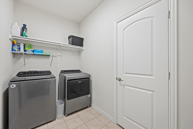 2025 Meliana Dr, Little Elm, TX 75068 - laundry room featuring washing machine and dryer and light tile patterned flooring