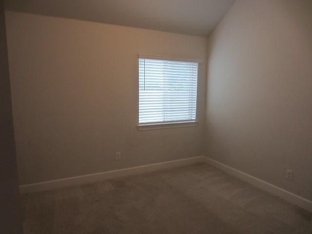 1813 Terrace Way, Argyle, TX 76226 - empty room with light colored carpet and vaulted ceiling