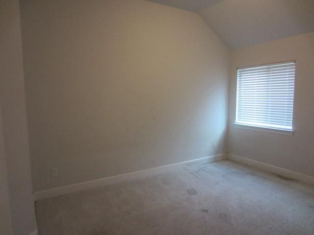 1813 Terrace Way, Argyle, TX 76226 - carpeted spare room featuring vaulted ceiling and baseboards