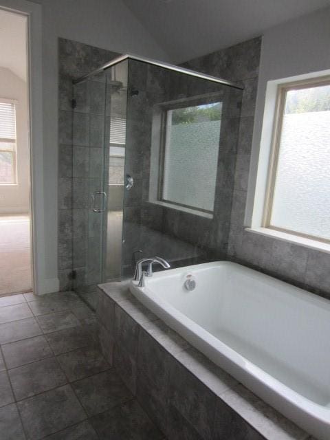 1813 Terrace Way, Argyle, TX 76226 - full bathroom featuring a garden tub, a shower stall, lofted ceiling, and tile patterned flooring