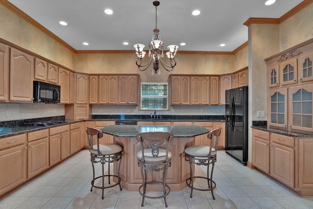 9664 Norris Ferry Rd, Shreveport, LA 71106 - kitchen with black appliances, recessed lighting, a chandelier, light tile patterned floors, and a center island