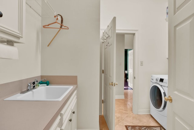 9664 Norris Ferry Rd, Shreveport, LA 71106 - washroom featuring washer / clothes dryer, cabinet space, and light tile patterned flooring