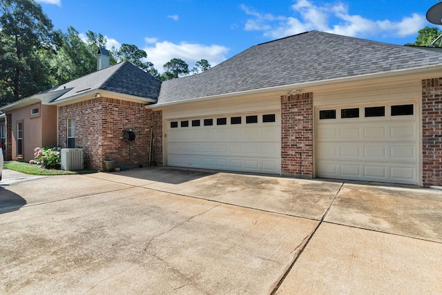 9664 Norris Ferry Rd, Shreveport, LA 71106 - view of property exterior featuring a shingled roof, brick siding, concrete driveway, a garage, and a chimney