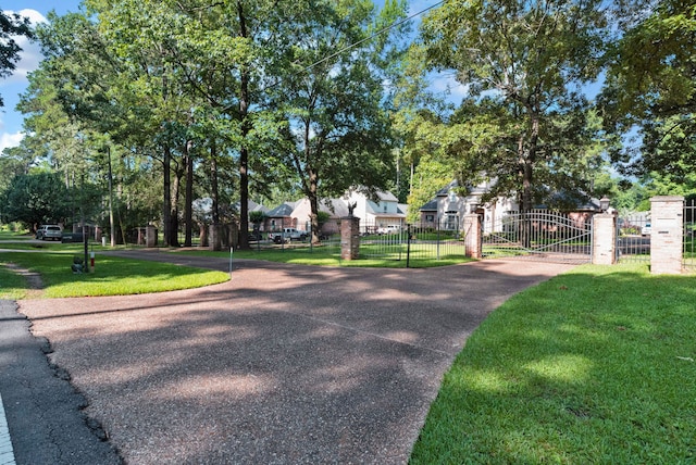 9664 Norris Ferry Rd, Shreveport, LA 71106 - surrounding community featuring a gate and a fenced front yard