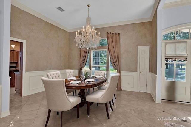 9664 Norris Ferry Rd, Shreveport, LA 71106 - dining space featuring a chandelier, a decorative wall, ornamental molding, and a wainscoted wall