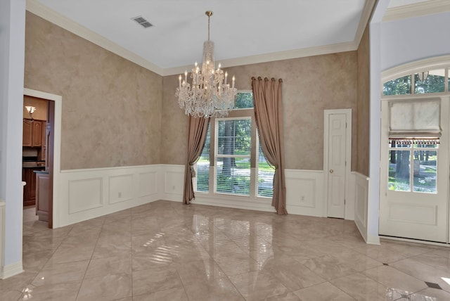 9664 Norris Ferry Rd, Shreveport, LA 71106 - unfurnished dining area featuring a chandelier, light marble finish floors, a decorative wall, wainscoting, and ornamental molding
