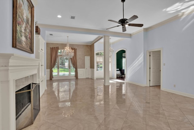 9664 Norris Ferry Rd, Shreveport, LA 71106 - unfurnished living room featuring a decorative wall, ornamental molding, arched walkways, a ceiling fan, and a chandelier