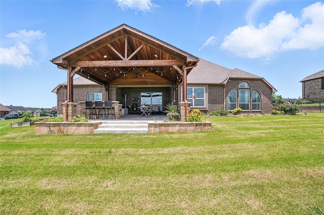12022 Livingston Way, Talty, TX 75126 - rear view of property with a lawn, brick siding, and a patio
