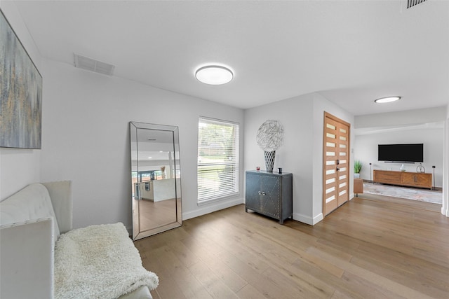 12211 Quincy Ln, Dallas, TX 75230 - living area with light wood-type flooring and baseboards