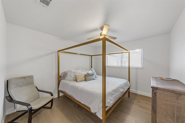 12211 Quincy Ln, Dallas, TX 75230 - bedroom with ceiling fan and wood finished floors