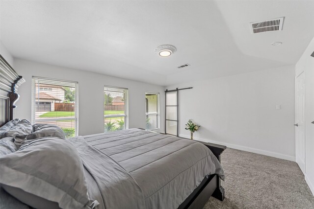 12211 Quincy Ln, Dallas, TX 75230 - bedroom with carpet and a barn door