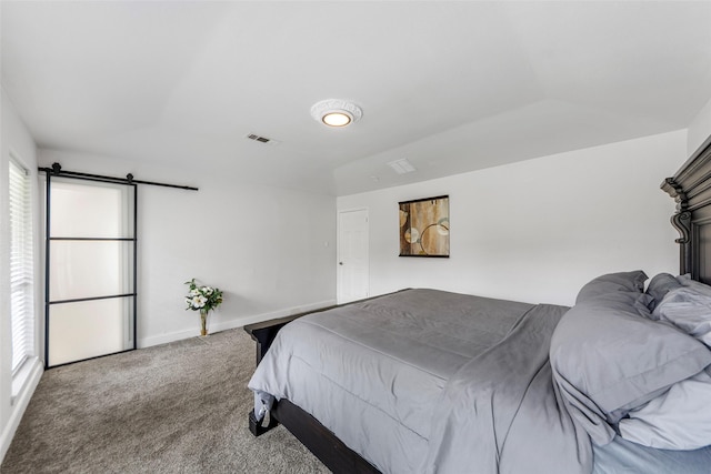 12211 Quincy Ln, Dallas, TX 75230 - carpeted bedroom featuring baseboards and a barn door