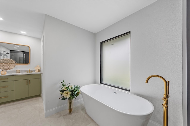 12211 Quincy Ln, Dallas, TX 75230 - bathroom with vanity, a soaking tub, tile patterned flooring, and recessed lighting