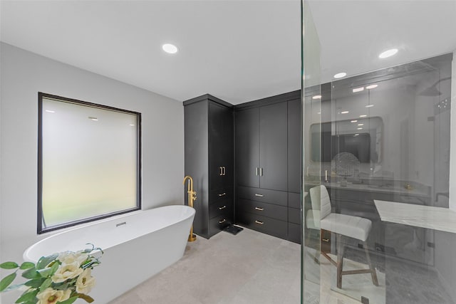 12211 Quincy Ln, Dallas, TX 75230 - bathroom with a shower stall, a freestanding bath, and recessed lighting