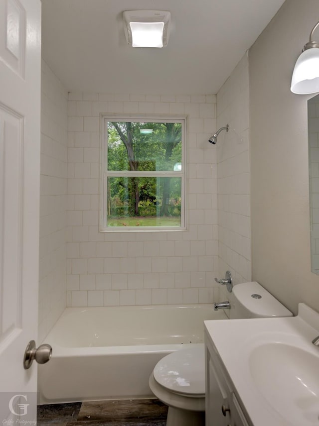 6312 Canal Blvd, Shreveport, LA 71108 - bathroom featuring vanity, wood finished floors, and bathing tub / shower combination