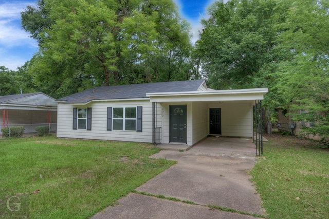 6312 Canal Blvd, Shreveport, LA 71108 - ranch-style home with concrete driveway, a front lawn, and an attached carport