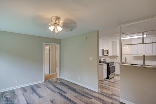 6312 Canal Blvd, Shreveport, LA 71108 - empty room with ceiling fan and light wood-style floors