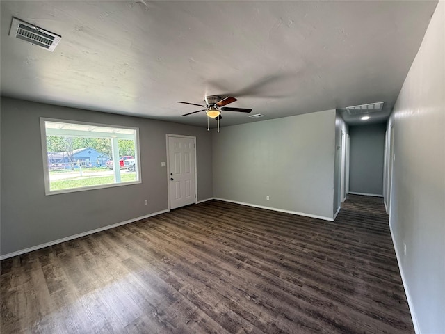 5506 Urbanview St, Sansom Park, TX 76114 - empty room with dark wood-type flooring, ceiling fan, and attic access