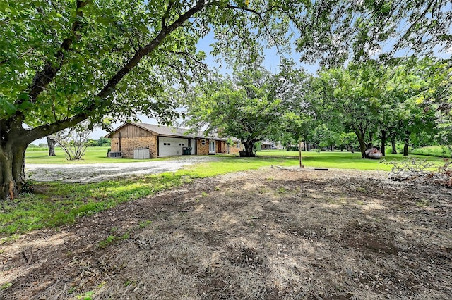 12906 Fm 902, Dorchester, TX 75459 - view of front of home with a front yard, brick siding, and an attached garage